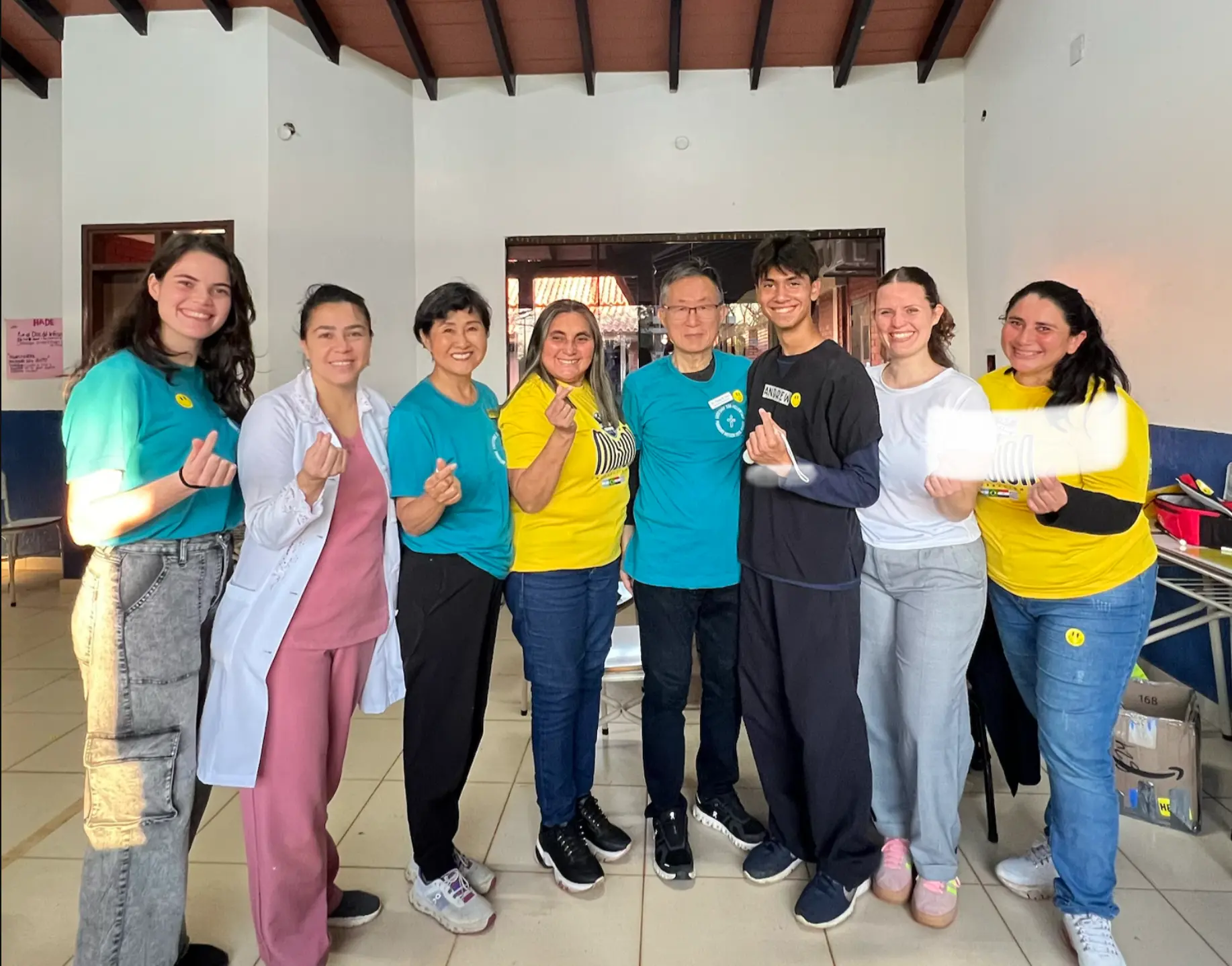 DOTRI volunteers and healthcare professionals smiling together during a medical mission in Paraguay
