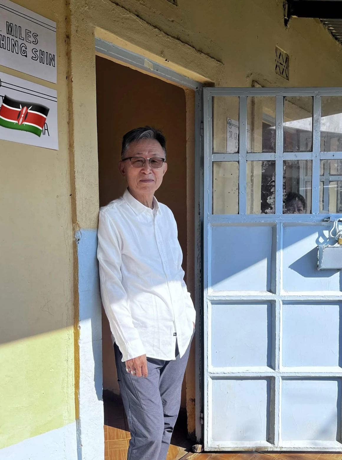 Dr. Chang B. Shin standing at a clinic doorway during a medical mission in Kenya